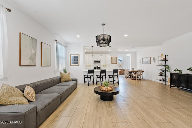 2204 E Kelly Dr, Gilbert, AZ 85298 - living room featuring baseboards, recessed lighting, and a notable chandelier
