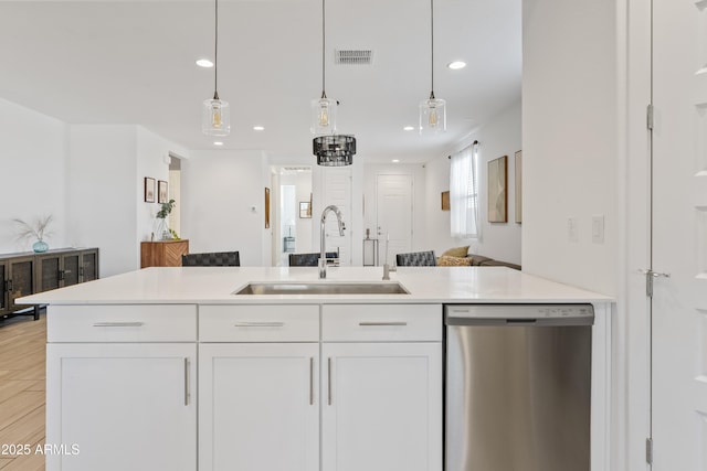 2204 E Kelly Dr, Gilbert, AZ 85298 - kitchen featuring open floor plan, a sink, visible vents, dishwasher, and white cabinets