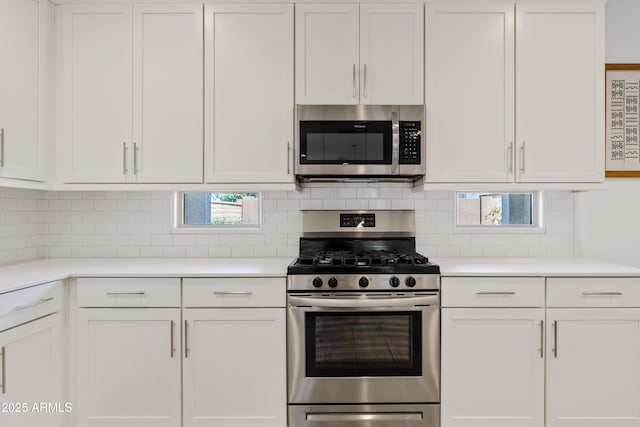 2204 E Kelly Dr, Gilbert, AZ 85298 - kitchen featuring light countertops, stainless steel appliances, white cabinets, and tasteful backsplash