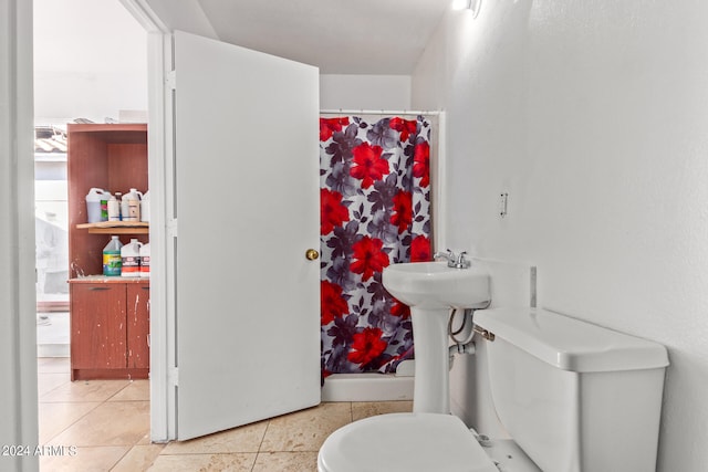 bathroom featuring tile patterned flooring and toilet