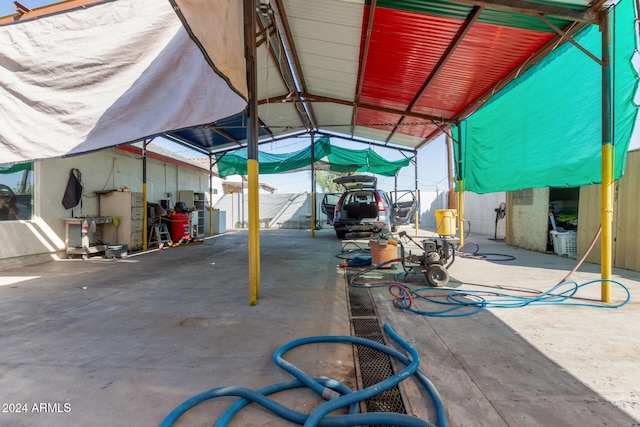 exterior space with concrete floors and vaulted ceiling