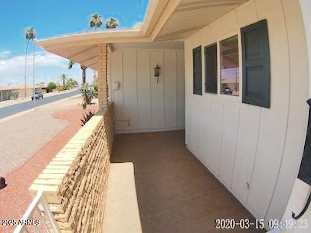 14409 N Mcphee Dr, Sun City, AZ 85351 - view of exterior entry featuring a balcony
