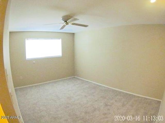 14409 N Mcphee Dr, Sun City, AZ 85351 - carpeted empty room featuring ceiling fan and baseboards