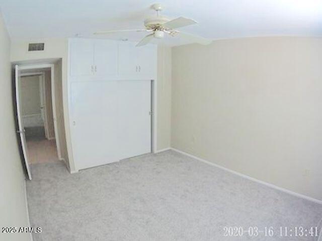 14409 N Mcphee Dr, Sun City, AZ 85351 - unfurnished room featuring ceiling fan, light colored carpet, and baseboards