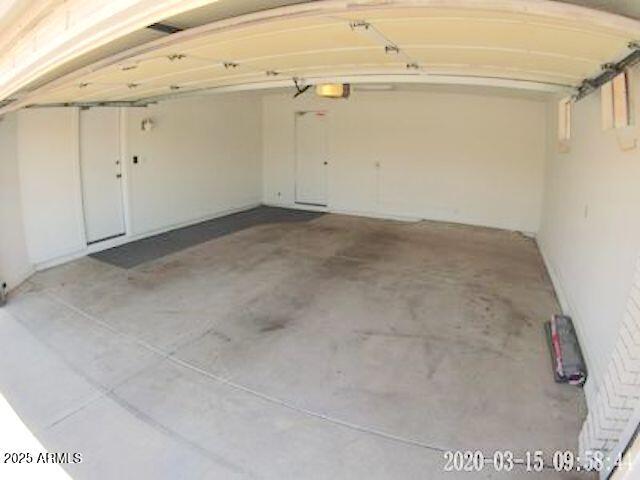 14409 N Mcphee Dr, Sun City, AZ 85351 - garage featuring a garage door opener