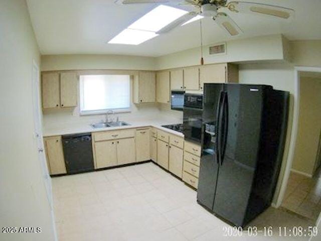 14409 N Mcphee Dr, Sun City, AZ 85351 - kitchen featuring black appliances, a sink, ceiling fan, light brown cabinets, and light countertops