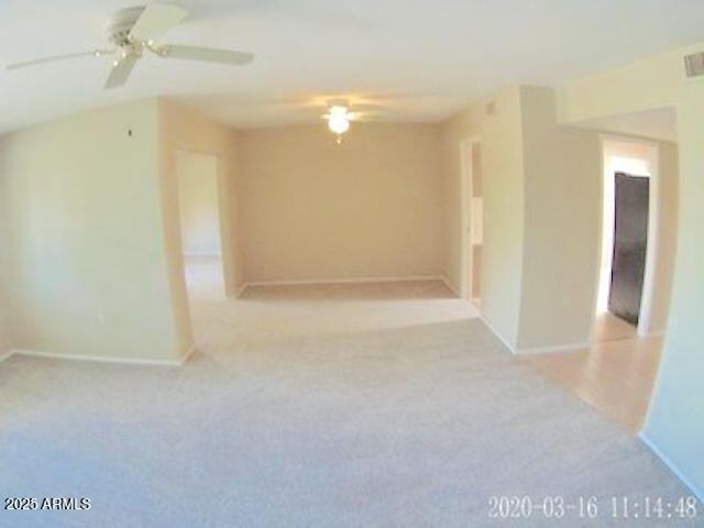 14409 N Mcphee Dr, Sun City, AZ 85351 - spare room featuring ceiling fan, baseboards, and carpet