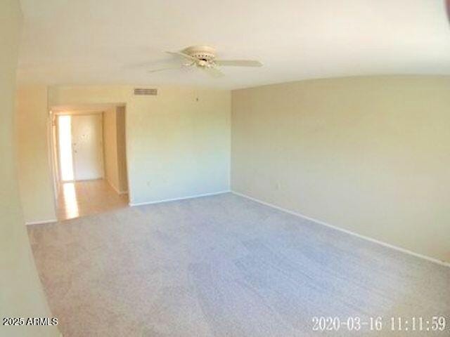 14409 N Mcphee Dr, Sun City, AZ 85351 - unfurnished room with a ceiling fan, baseboards, and carpet flooring