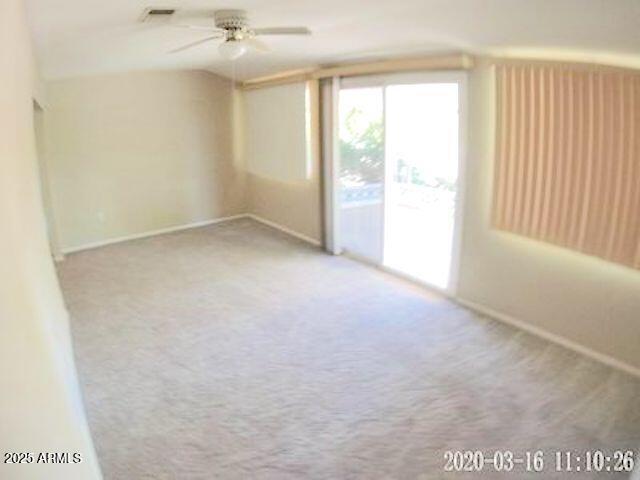 14409 N Mcphee Dr, Sun City, AZ 85351 - empty room with carpet, a ceiling fan, and baseboards