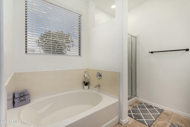 bathroom featuring separate shower and tub and tile patterned floors