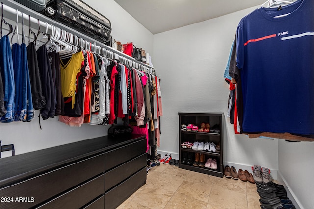 spacious closet featuring light tile patterned flooring