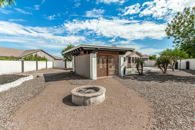 exterior space featuring a fire pit