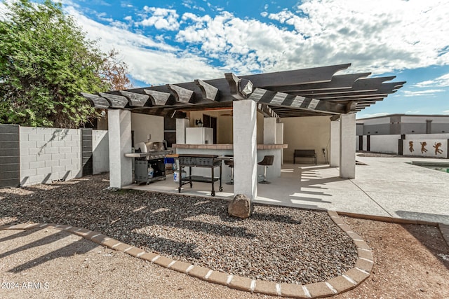 rear view of house with a pergola and a patio area