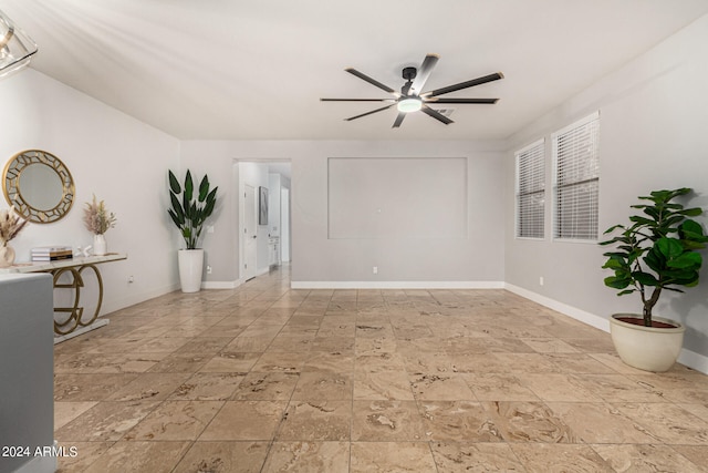 tiled empty room with ceiling fan