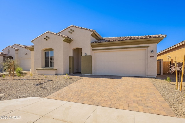 mediterranean / spanish house featuring a garage