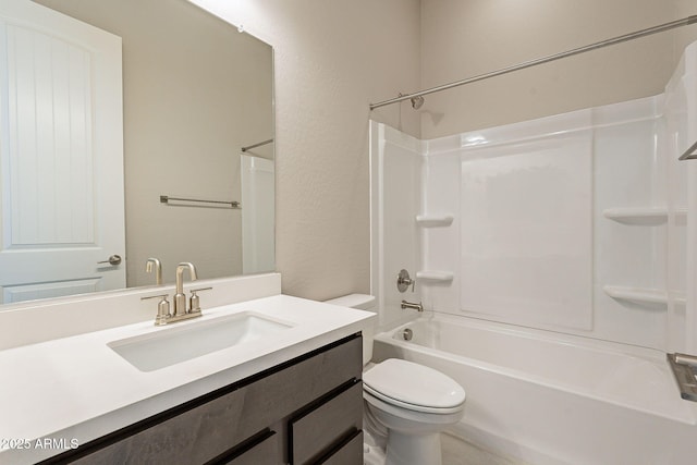 full bathroom featuring toilet, vanity, and  shower combination