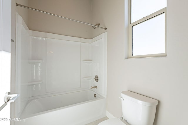 bathroom with shower / bathtub combination and toilet