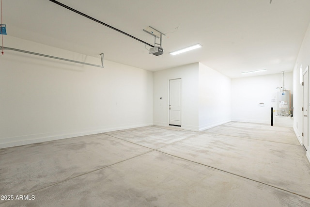 garage with a garage door opener and water heater