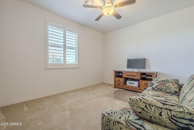 living room featuring ceiling fan and light colored carpet