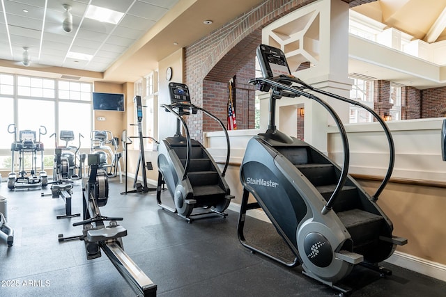 exercise room featuring a drop ceiling