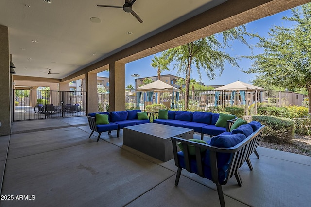 view of patio / terrace with ceiling fan and outdoor lounge area