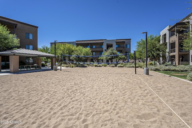 view of home's community with volleyball court and a gazebo