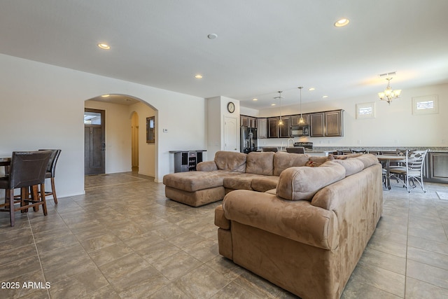 living room featuring a notable chandelier