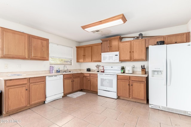 kitchen featuring sink and white appliances