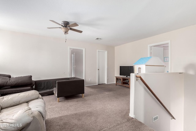 living room with carpet flooring and ceiling fan