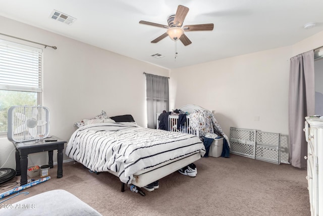 carpeted bedroom featuring ceiling fan