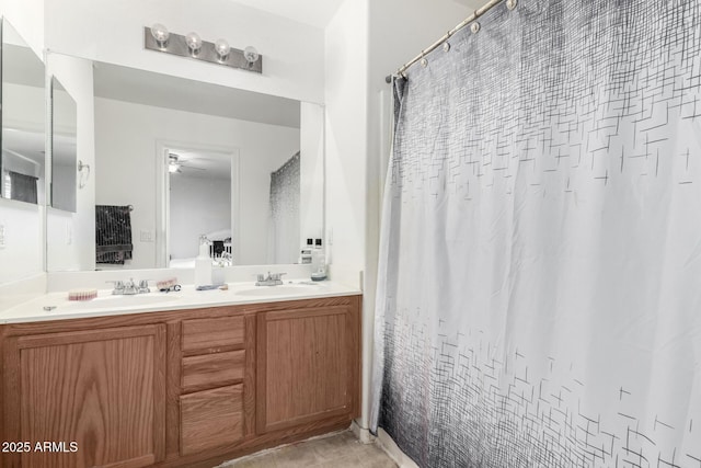 bathroom with tile patterned flooring and vanity