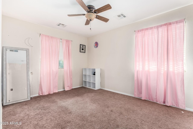 carpeted empty room with ceiling fan