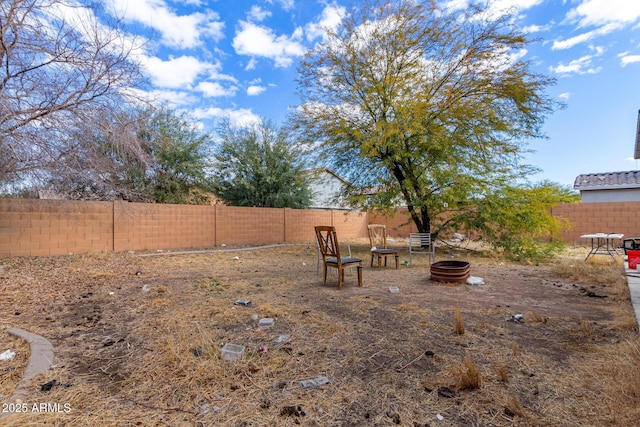 view of yard featuring a fire pit