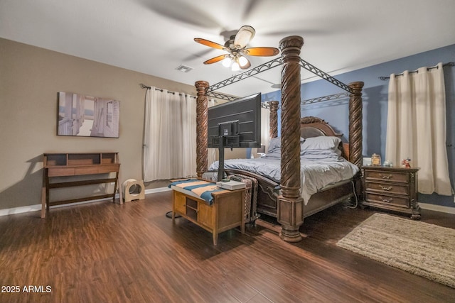 bedroom with ceiling fan and dark hardwood / wood-style flooring