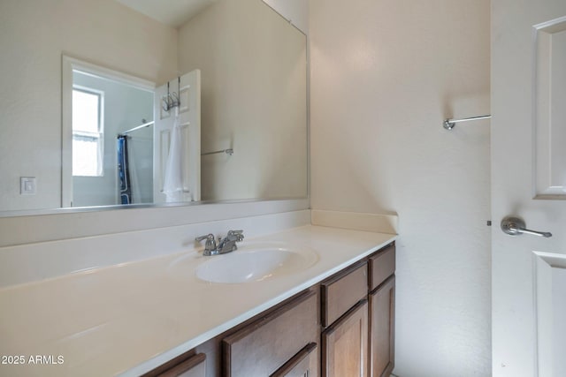 bathroom featuring vanity and walk in shower