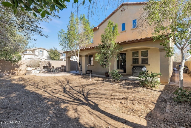 back of house with a patio area