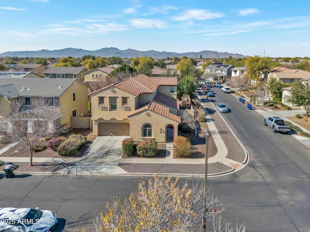 birds eye view of property with a mountain view