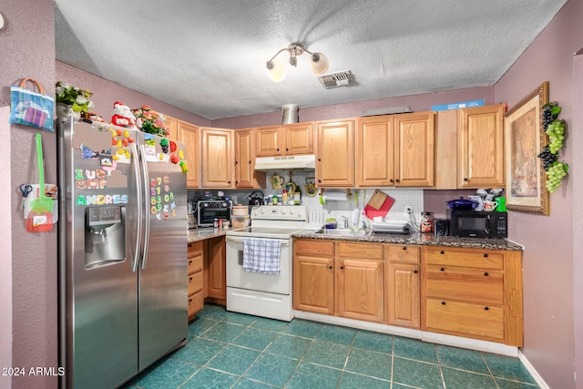 kitchen featuring backsplash, white electric range oven, dark stone counters, and stainless steel refrigerator with ice dispenser