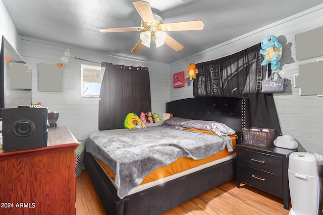 bedroom featuring ceiling fan and light wood-type flooring