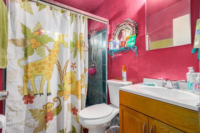 bathroom with toilet, curtained shower, and vanity