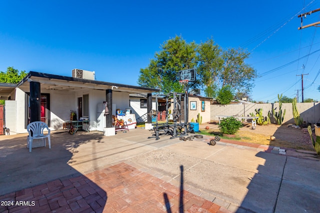 back of property featuring a patio and central AC unit