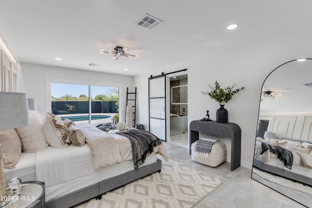 bedroom featuring a barn door and access to exterior