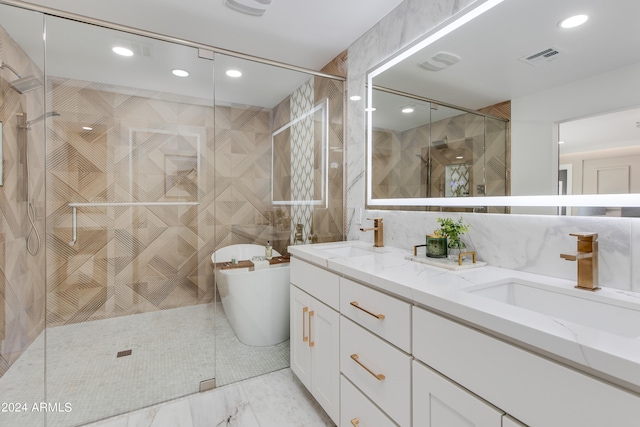 bathroom featuring tile walls, double vanity, tile flooring, and an enclosed shower