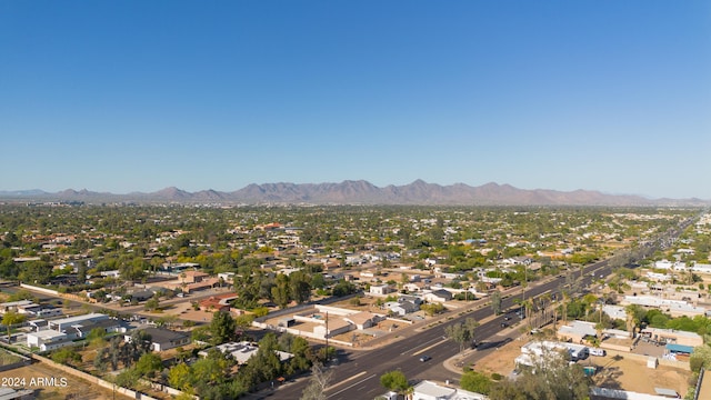 birds eye view of property with a mountain view