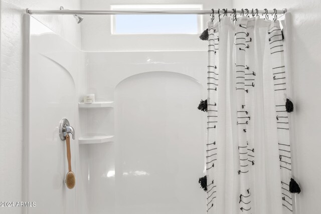 bathroom with a shower with shower curtain