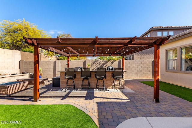 view of patio with a pergola and an outdoor bar