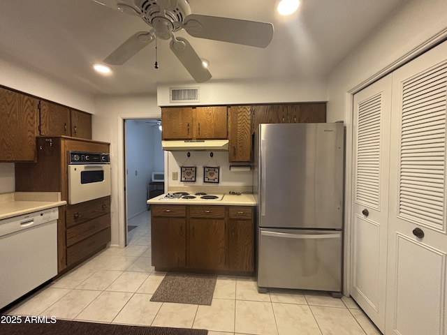 4537 E Emelita Ave, Mesa, AZ 85206 - kitchen with a ceiling fan, under cabinet range hood, white appliances, visible vents, and light countertops