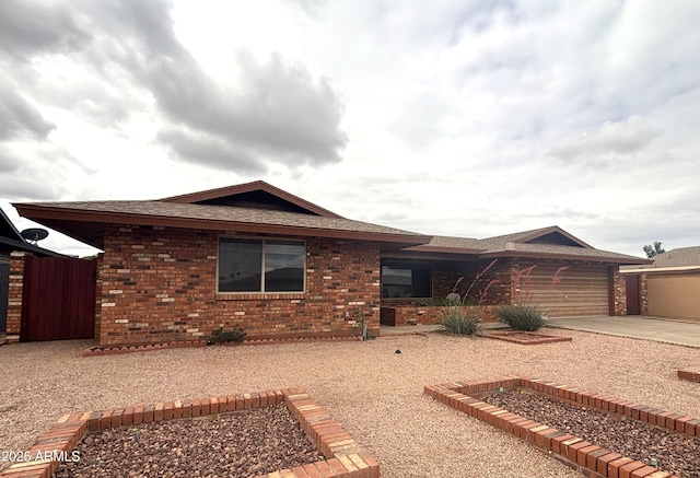 4537 E Emelita Ave, Mesa, AZ 85206 - ranch-style house featuring brick siding, driveway, a garage, and roof with shingles