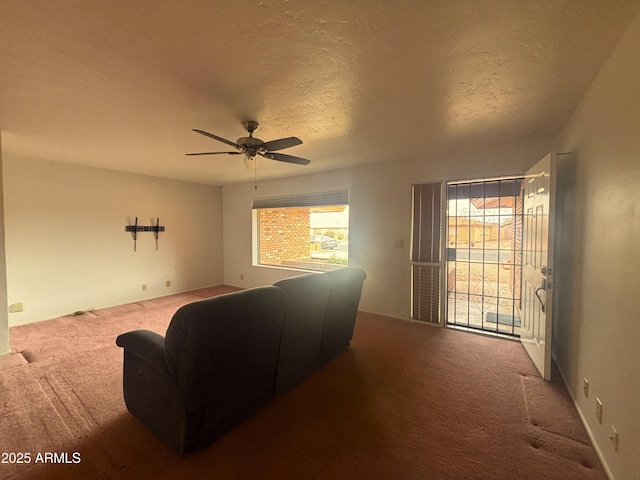 4537 E Emelita Ave, Mesa, AZ 85206 - living area featuring a textured ceiling, carpet, and a ceiling fan
