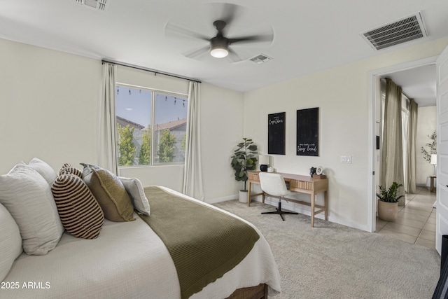 17976 W Ashley Dr, Goodyear, AZ 85338 - bedroom featuring light colored carpet, ceiling fan, and light tile patterned floors